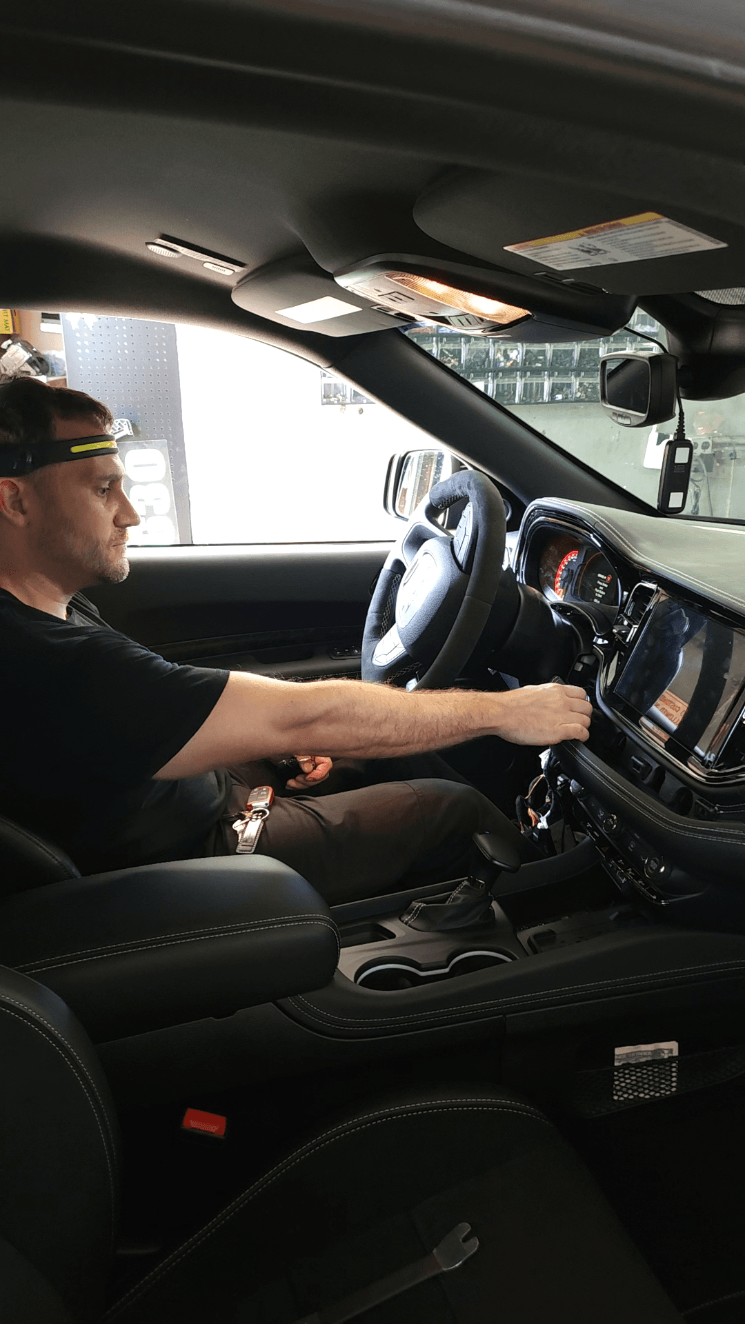 Parkway Car Stereo technician installing a dashboard system in-shop